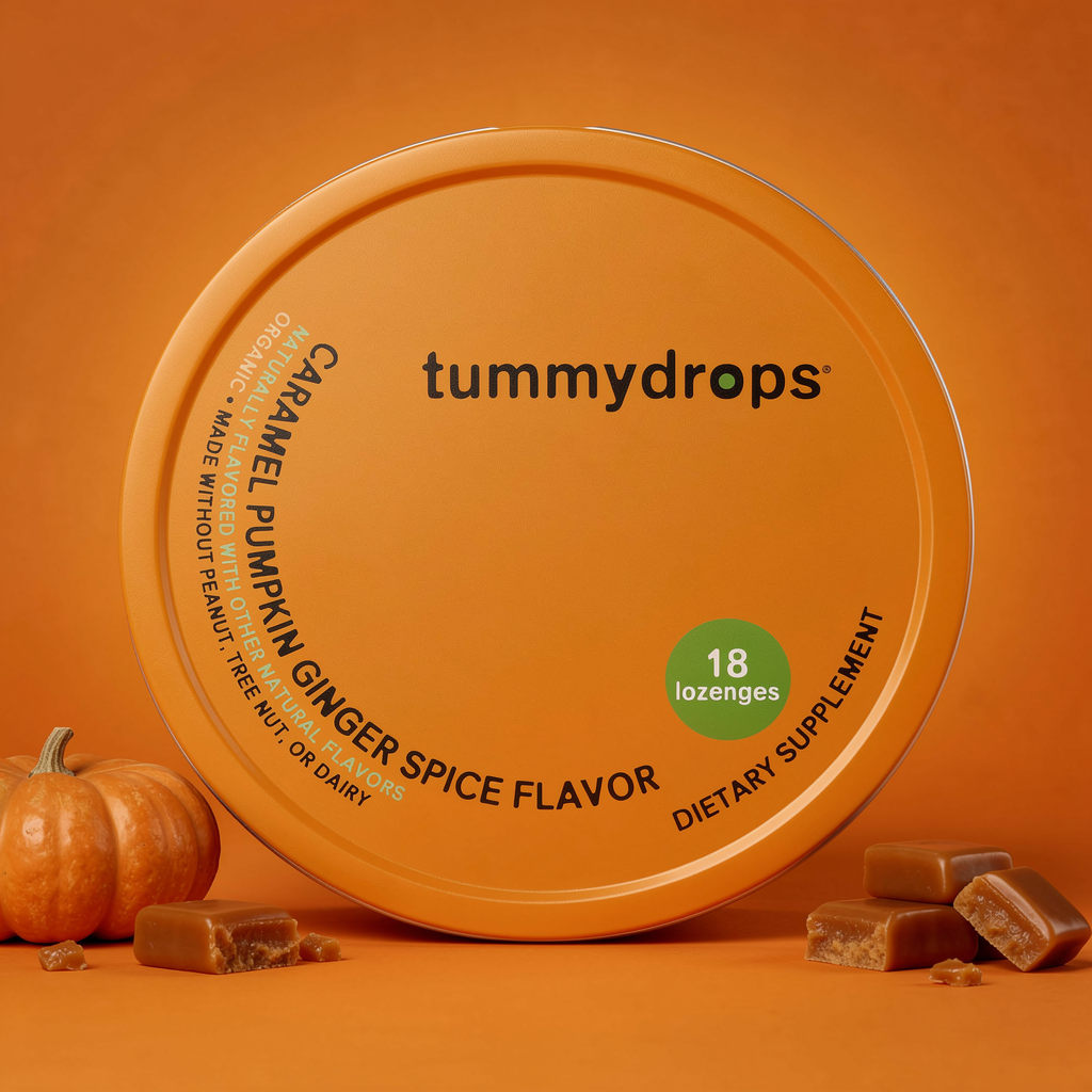 Tummydrops Caramel Pumpkin Ginger Spice flavor packaging on an orange background with lozenges.