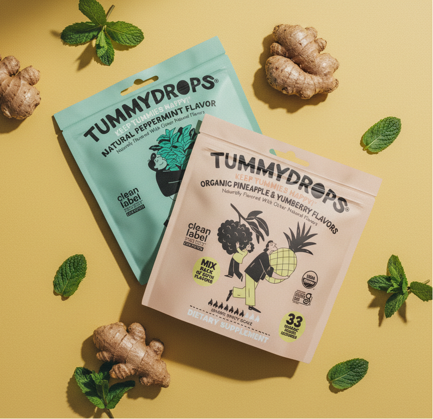 Overhead flat lay mustard surface with Tummydrops bags ginger and mint